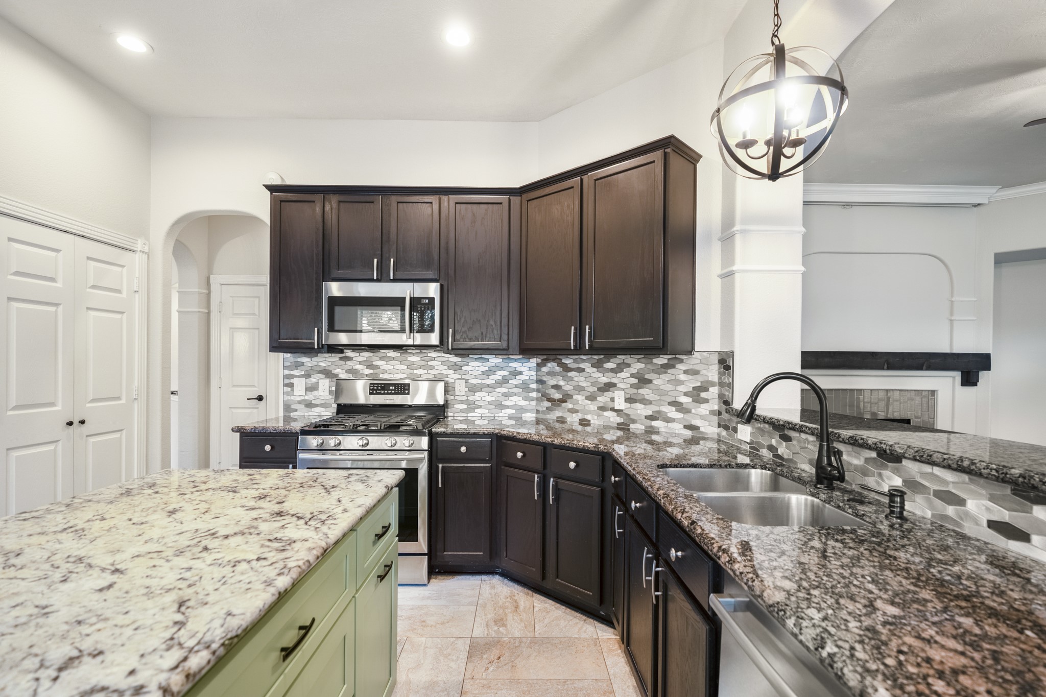 5802 Sawyer Bend Lane Spring, TX 77379 - Photo 12 of 50 a kitchen with stainless steel appliances granite countertop a sink stove and refrigerator