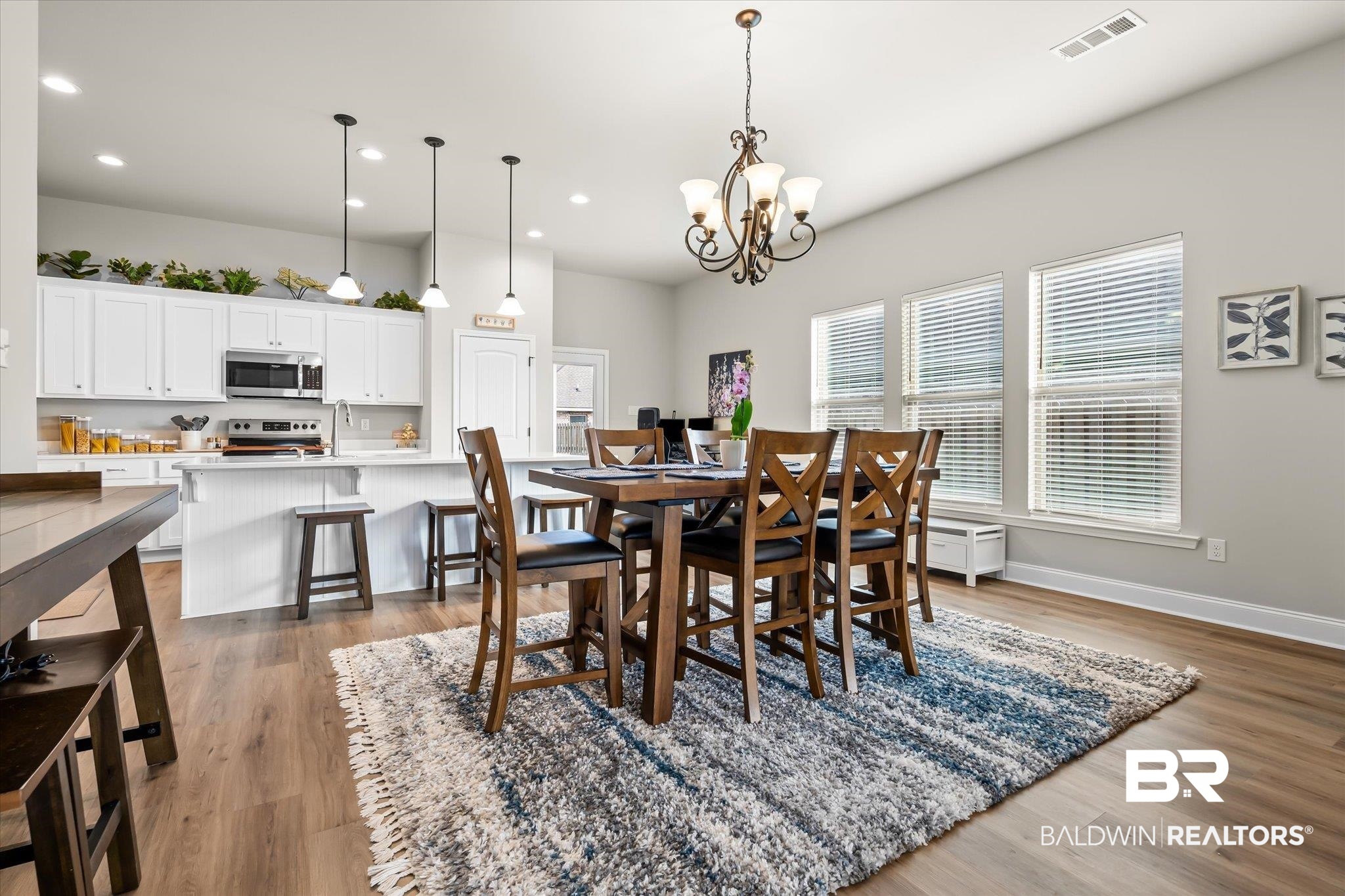 1116 Stella Road Foley, AL 36535 - Photo 6 of 29 Dining area featuring hardwood / wood-style floors and a chandelier