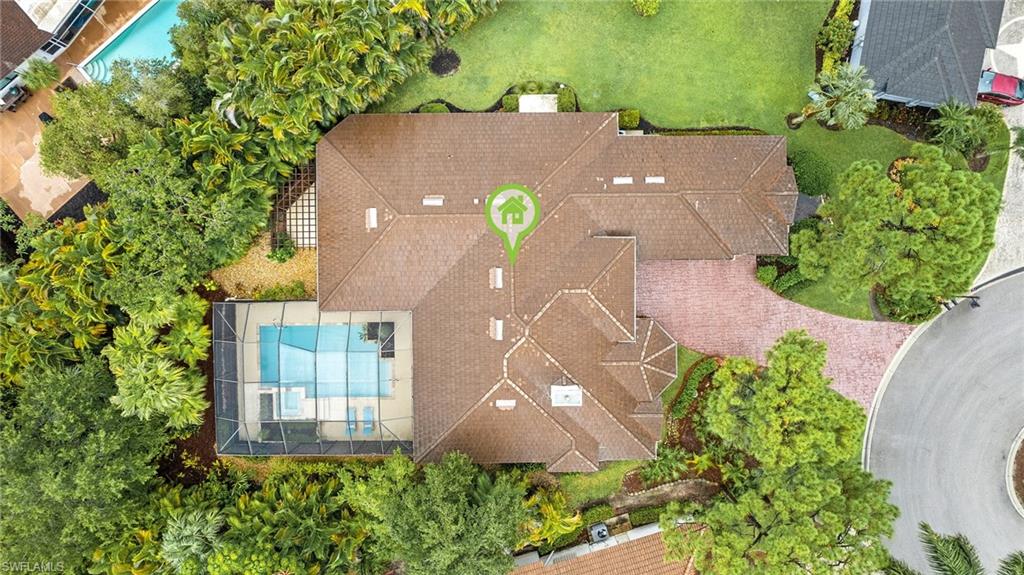 2229 Goshawk Court Naples, FL 34105 - Photo 25 of 27 an aerial view of a house with a yard and a large tree