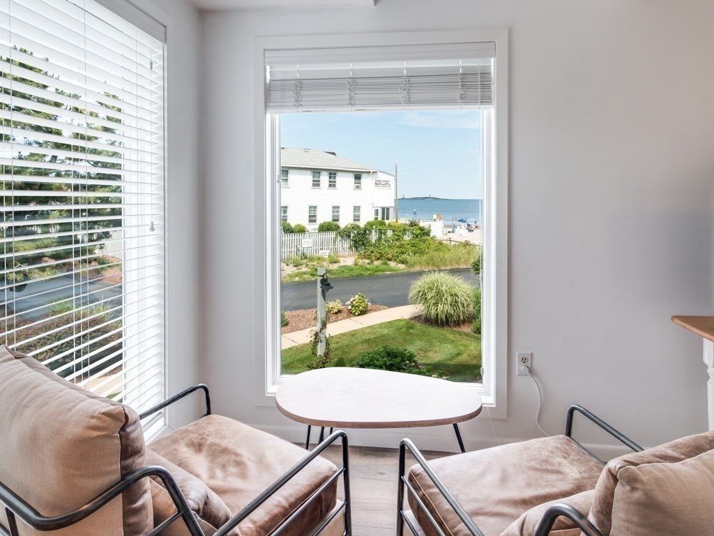 34 Rockport Road, Unit 14 Gloucester, MA 01930 - Photo 8 of 27 a view of a dining room with furniture window and outside view