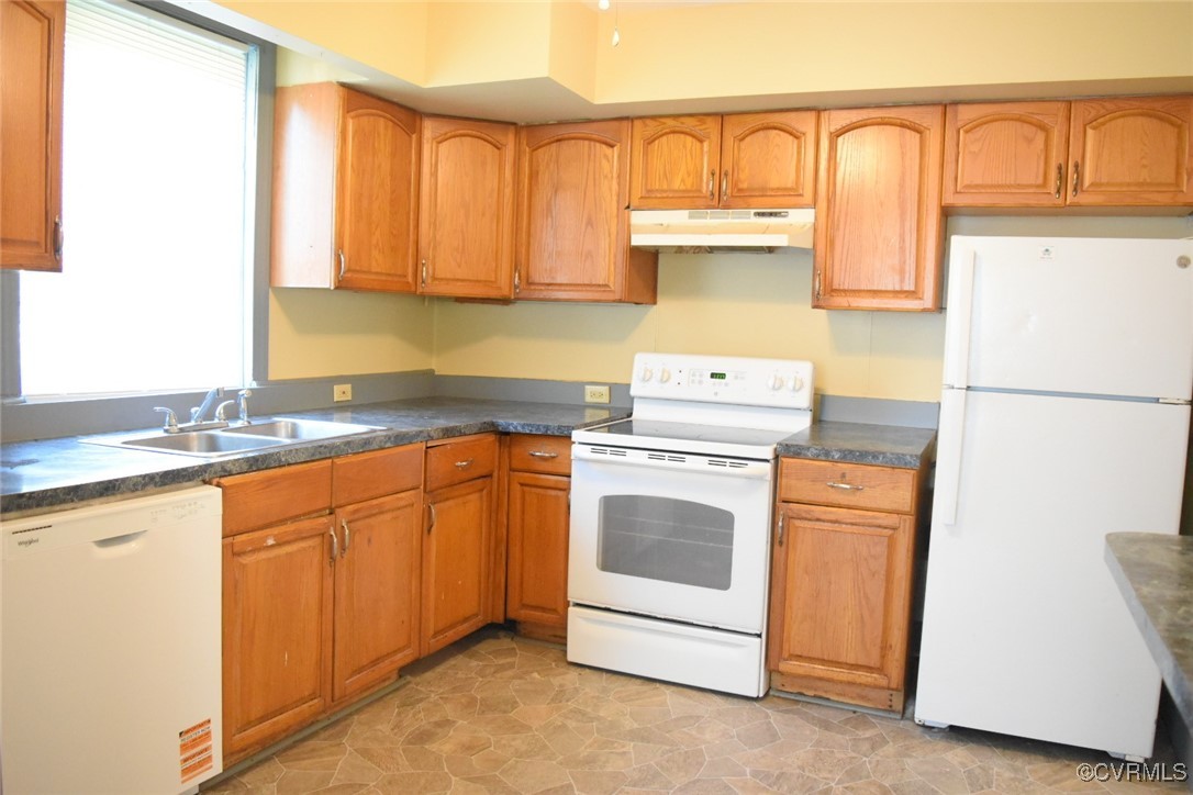 1642 Free State Road Meherrin, VA 23954 - Photo 13 of 24 a kitchen with stainless steel appliances granite countertop a sink a stove and a refrigerator