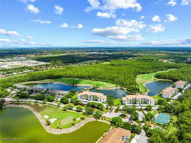 a view of a patio with table and chairs potted plants