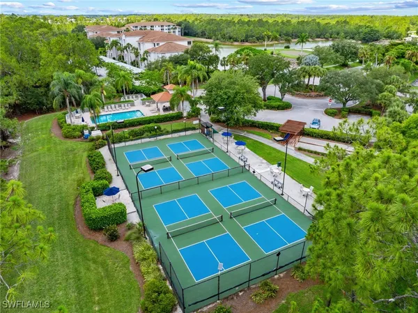 an aerial view of residential house with outdoor space and swimming pool