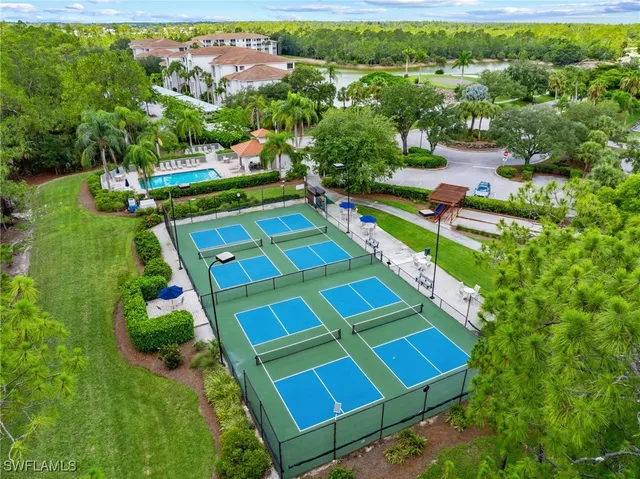 an aerial view of residential house with outdoor space and swimming pool