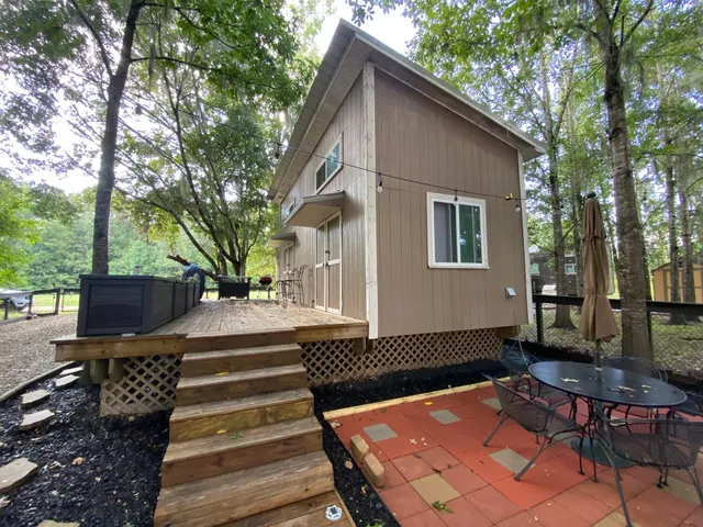 a view of a backyard with sitting area