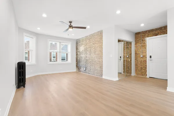a view of an empty room with a window
