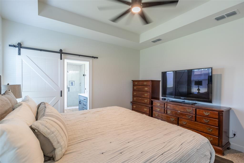 118 Corbyn Circle Tuscola, TX 79562 - Photo 14 of 36 a bedroom with a bed and a flat screen tv