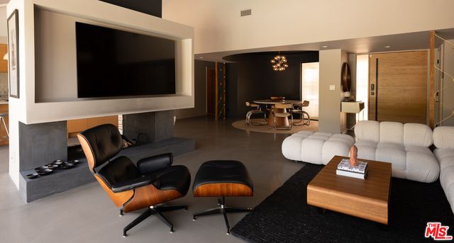 a dining room with table and chairs