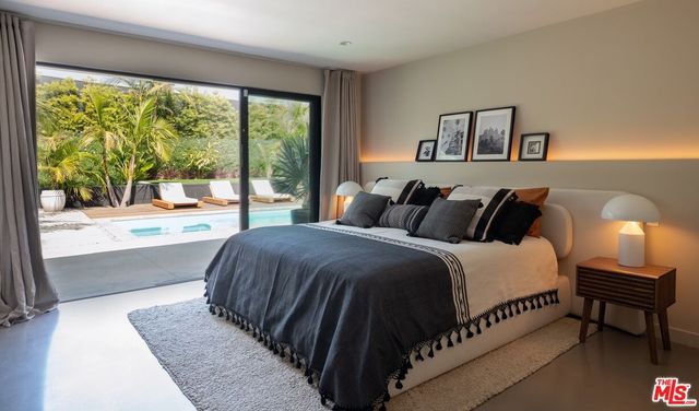 a living room with a couch and a mirror