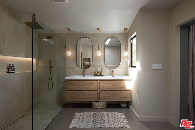 a white toilet sitting next to a bathroom sink