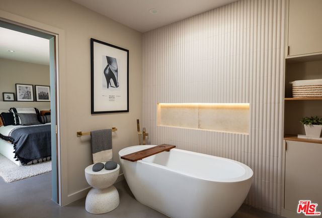 a bathroom with a bathtub and shower