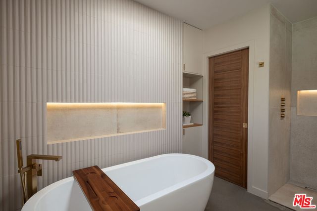 a bedroom with bed and a window