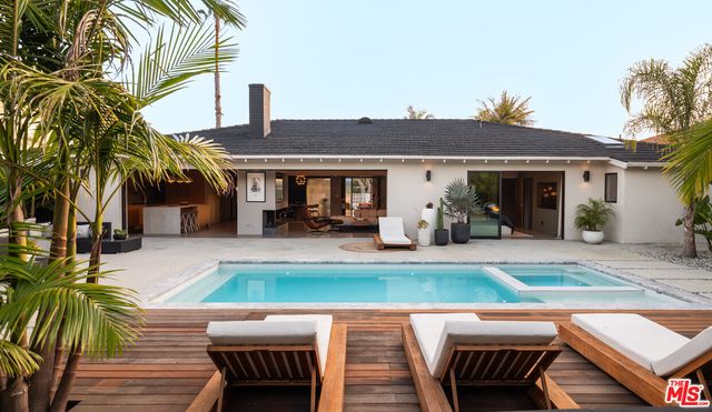 a view of a swimming pool with a patio