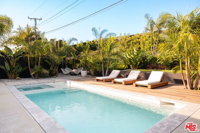 a view of a swimming pool with a patio