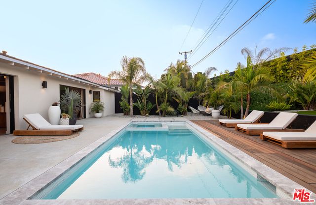 a view of a house with swimming pool