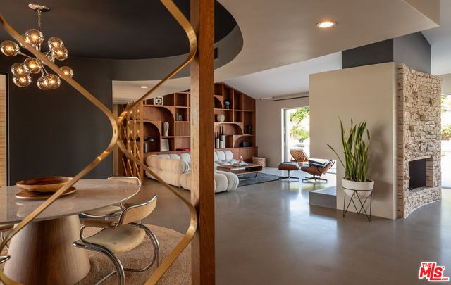 a living room with furniture lamp and rug