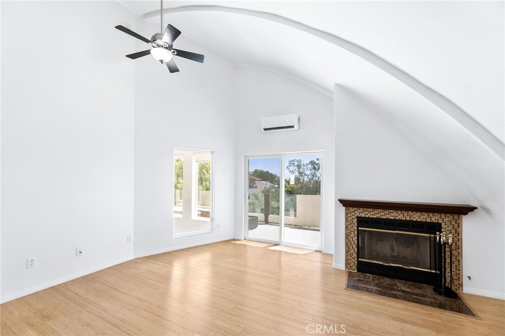 22870 Trigger Street Chatsworth, CA 91311 - Photo 27 of 64 an empty room with windows and fireplace