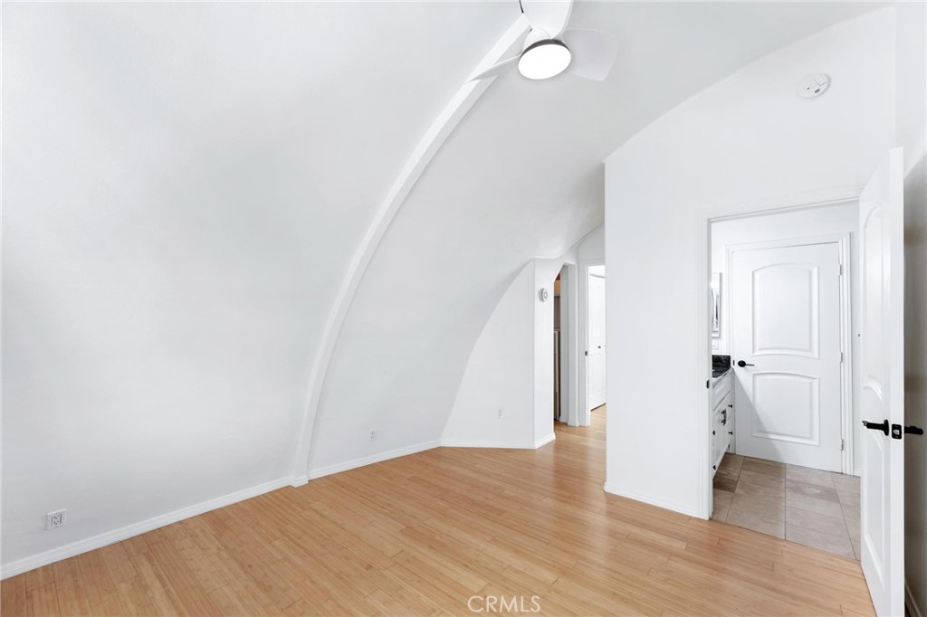 22870 Trigger Street Chatsworth, CA 91311 - Photo 36 of 64 a view of a hallway with wooden floor and stairs