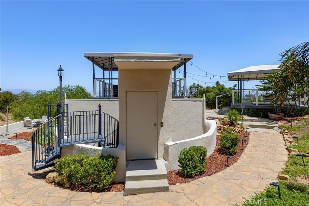 22870 Trigger Street Chatsworth, CA 91311 - Photo 41 of 64 a view of a house with a flower garden