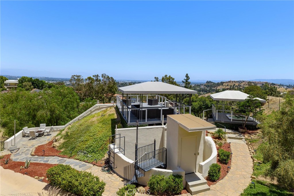 22870 Trigger Street Chatsworth, CA 91311 - Photo 47 of 64 a terrace with outdoor seating and trees