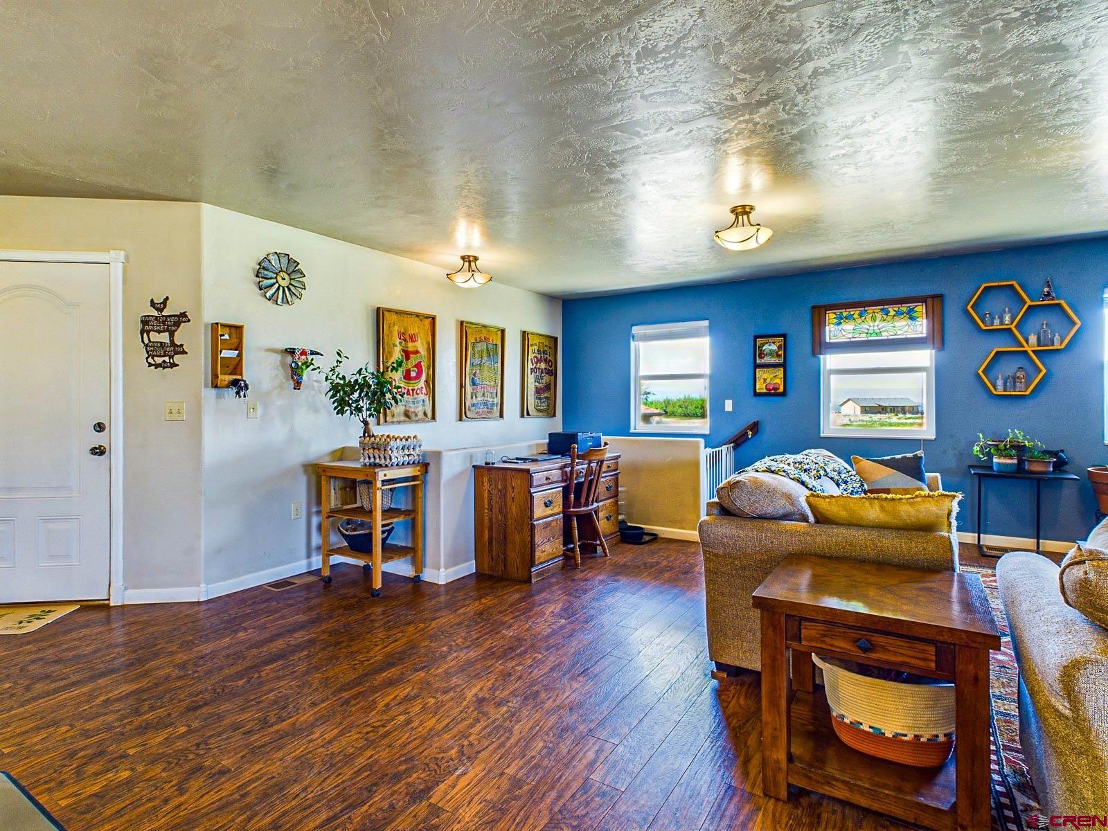 20260 Fawn Circle Eckert, CO 81418 - Photo 12 of 35 a living room with furniture and wooden floor