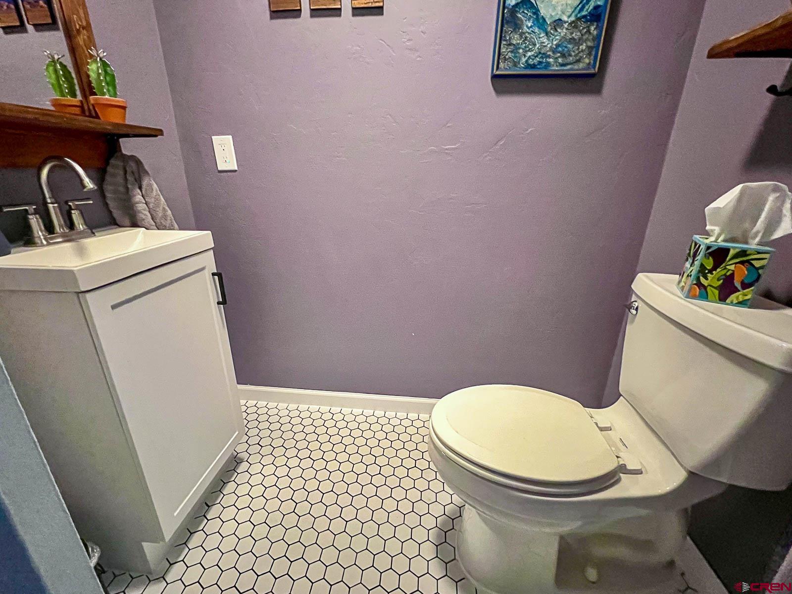 20260 Fawn Circle Eckert, CO 81418 - Photo 16 of 35 a white toilet sitting next to a bathroom sink