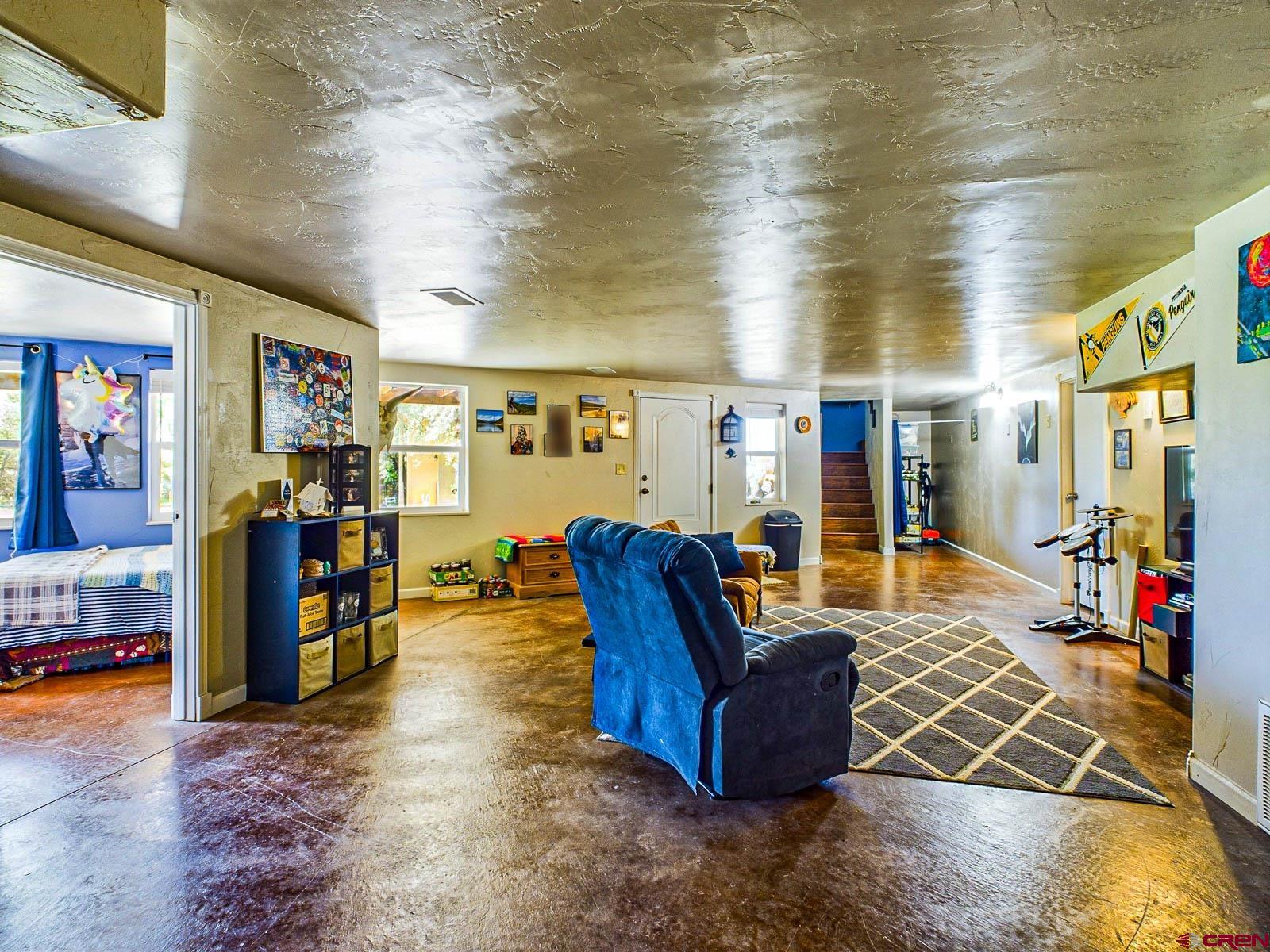 20260 Fawn Circle Eckert, CO 81418 - Photo 22 of 35 a living room with furniture and a flat screen tv