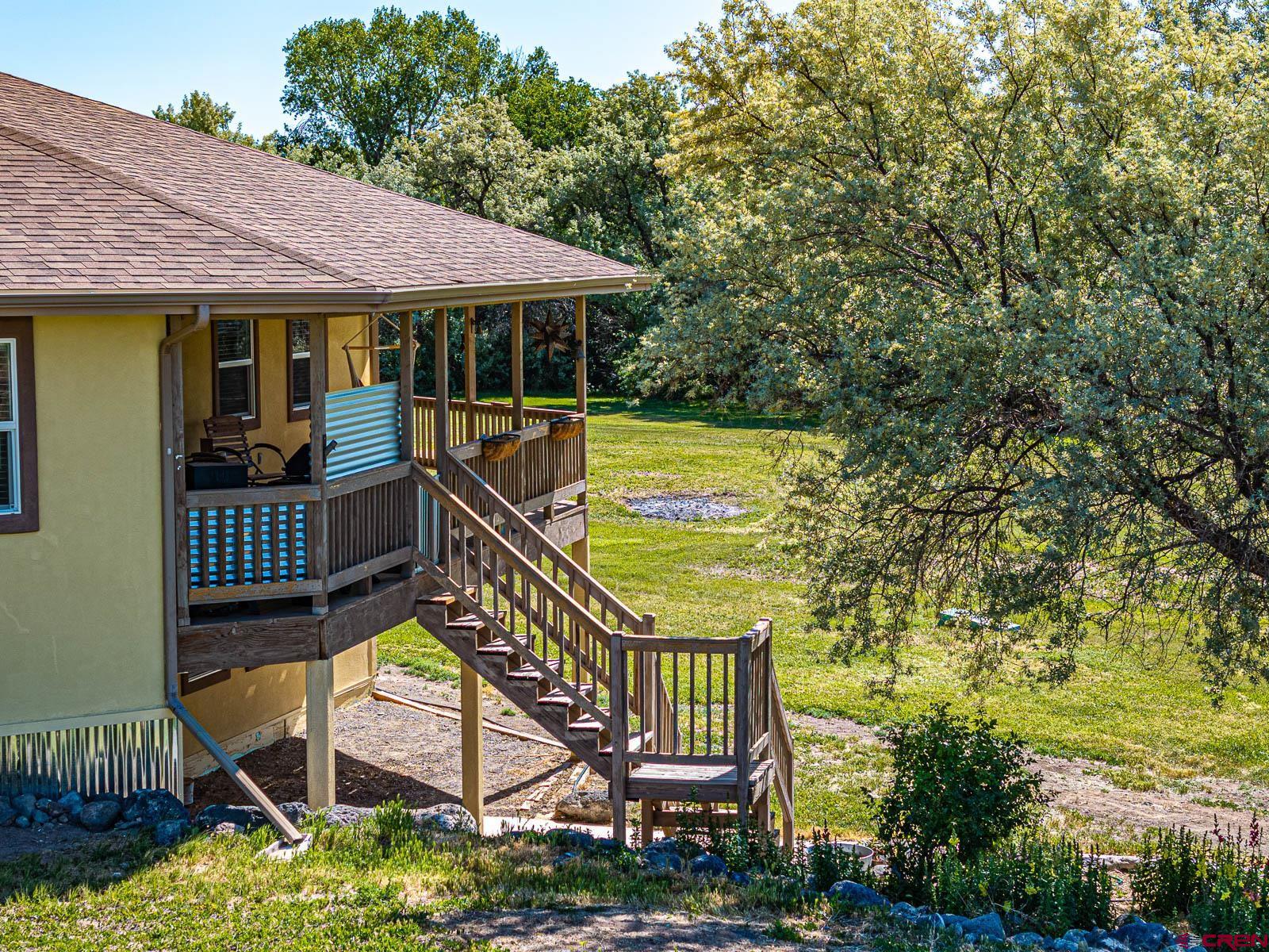 20260 Fawn Circle Eckert, CO 81418 - Photo 28 of 35 a view of a chair and table in the balcony