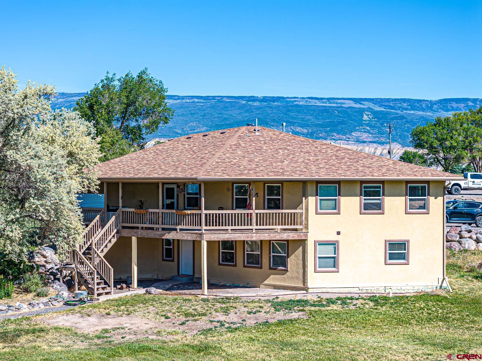 20260 Fawn Circle Eckert, CO 81418 - Photo 29 of 35 front view of a house with a yard