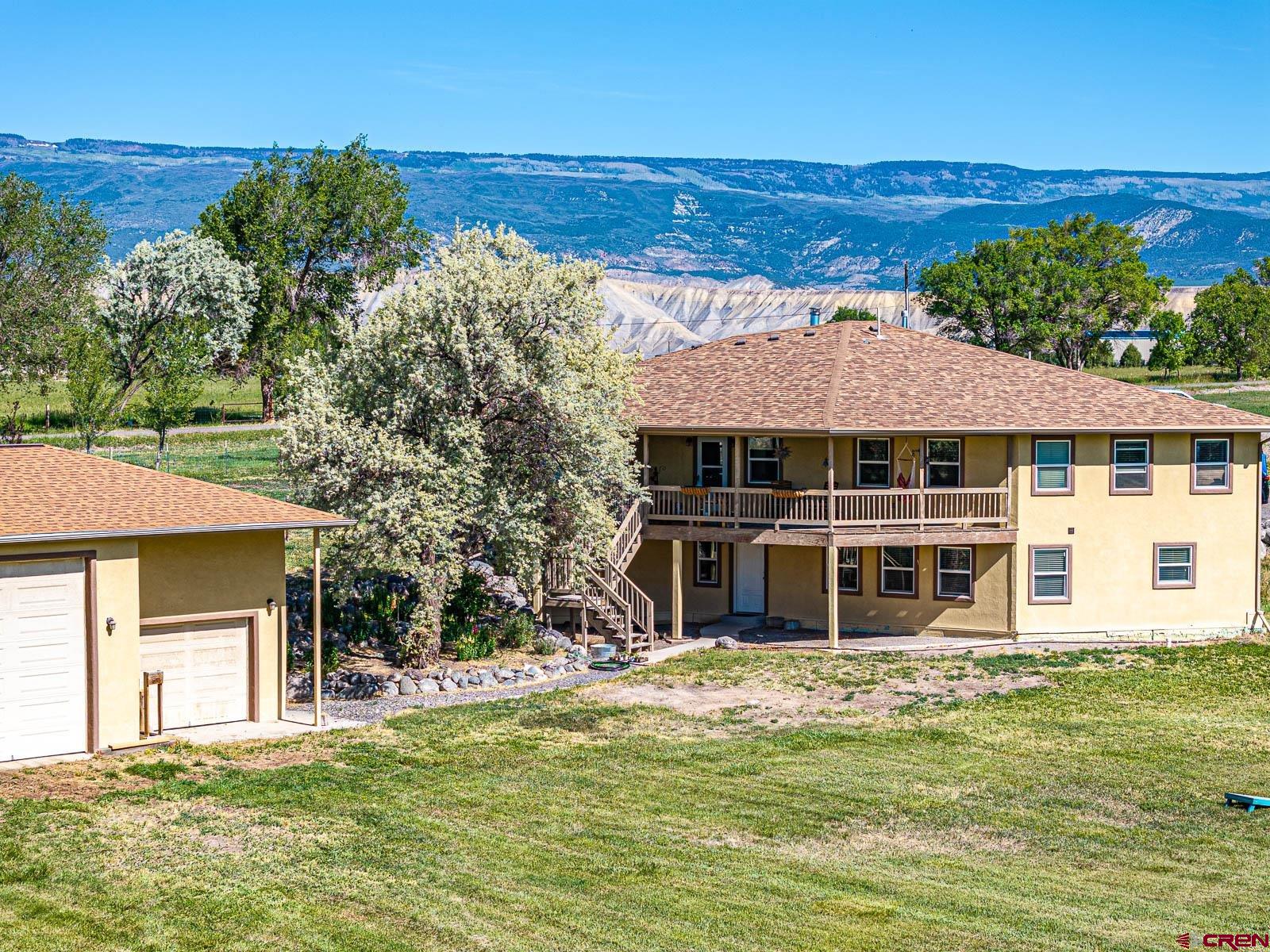 20260 Fawn Circle Eckert, CO 81418 - Photo 30 of 35 a house with swimming pool in front of it