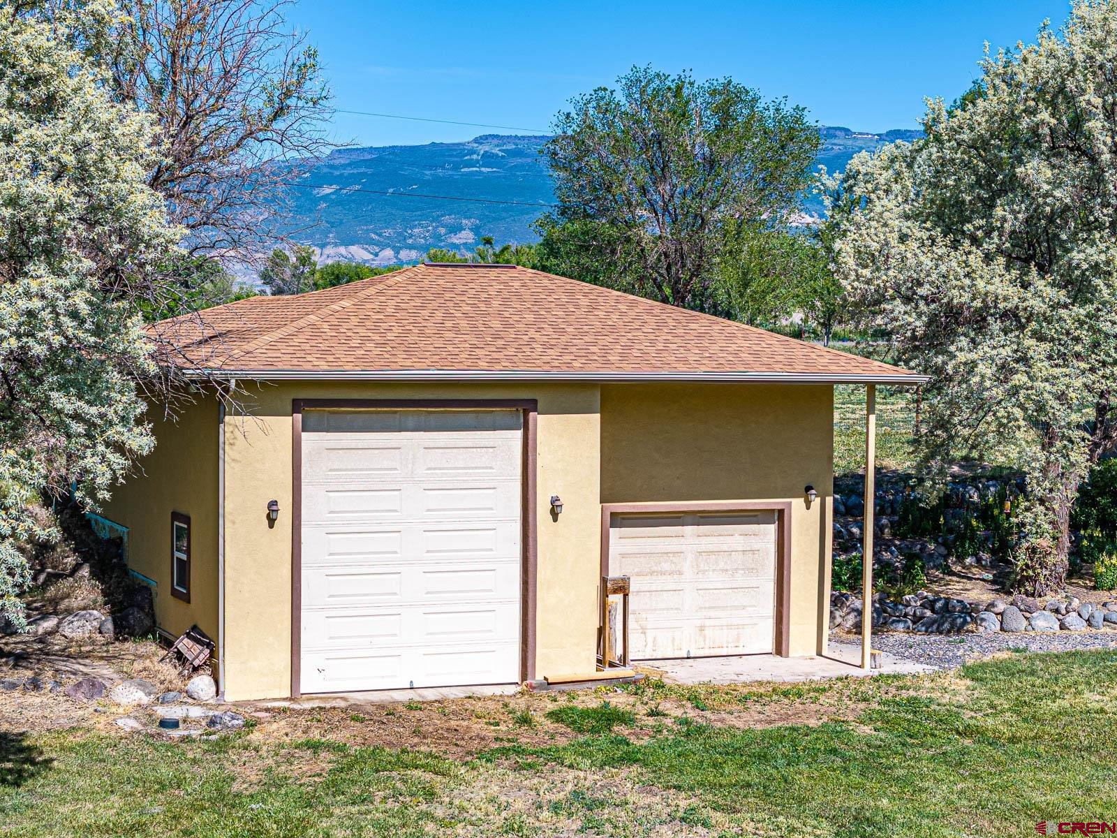 20260 Fawn Circle Eckert, CO 81418 - Photo 31 of 35 a front view of a house with a yard
