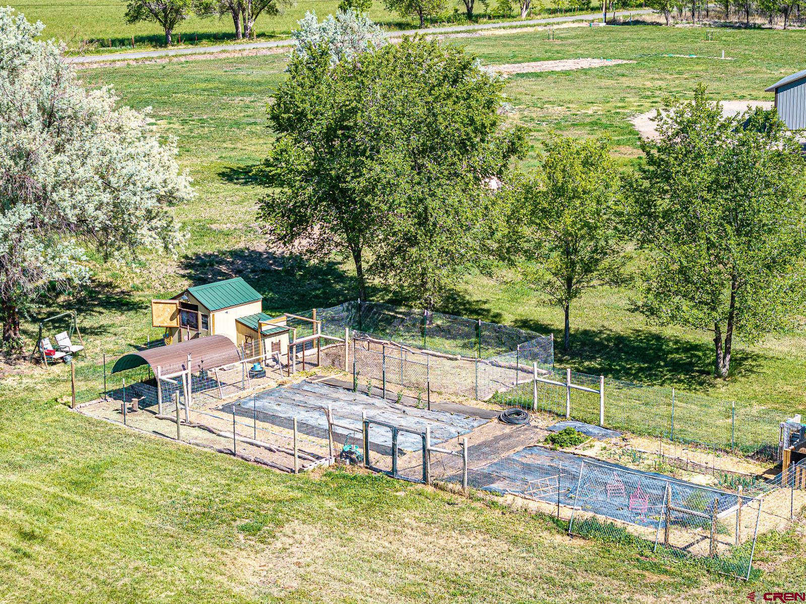 20260 Fawn Circle Eckert, CO 81418 - Photo 34 of 35 a view of a chair and tables in the garden