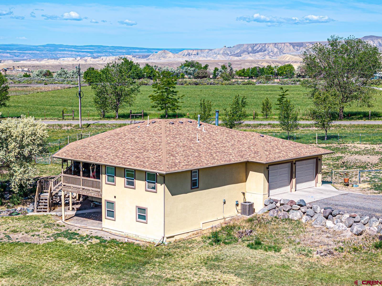20260 Fawn Circle Eckert, CO 81418 - Photo 5 of 35 an aerial view of a house with garden space and lake view