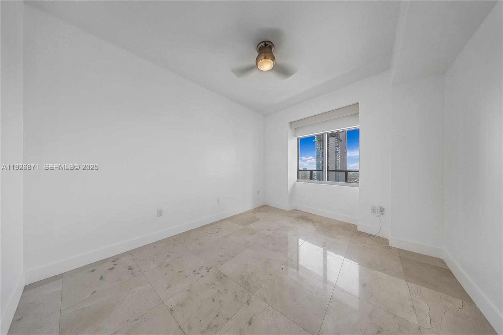 1100 Biscayne Boulevard, Unit 3103 Miami, FL 33132 - Photo 18 of 28 an empty room with a empty space and windows