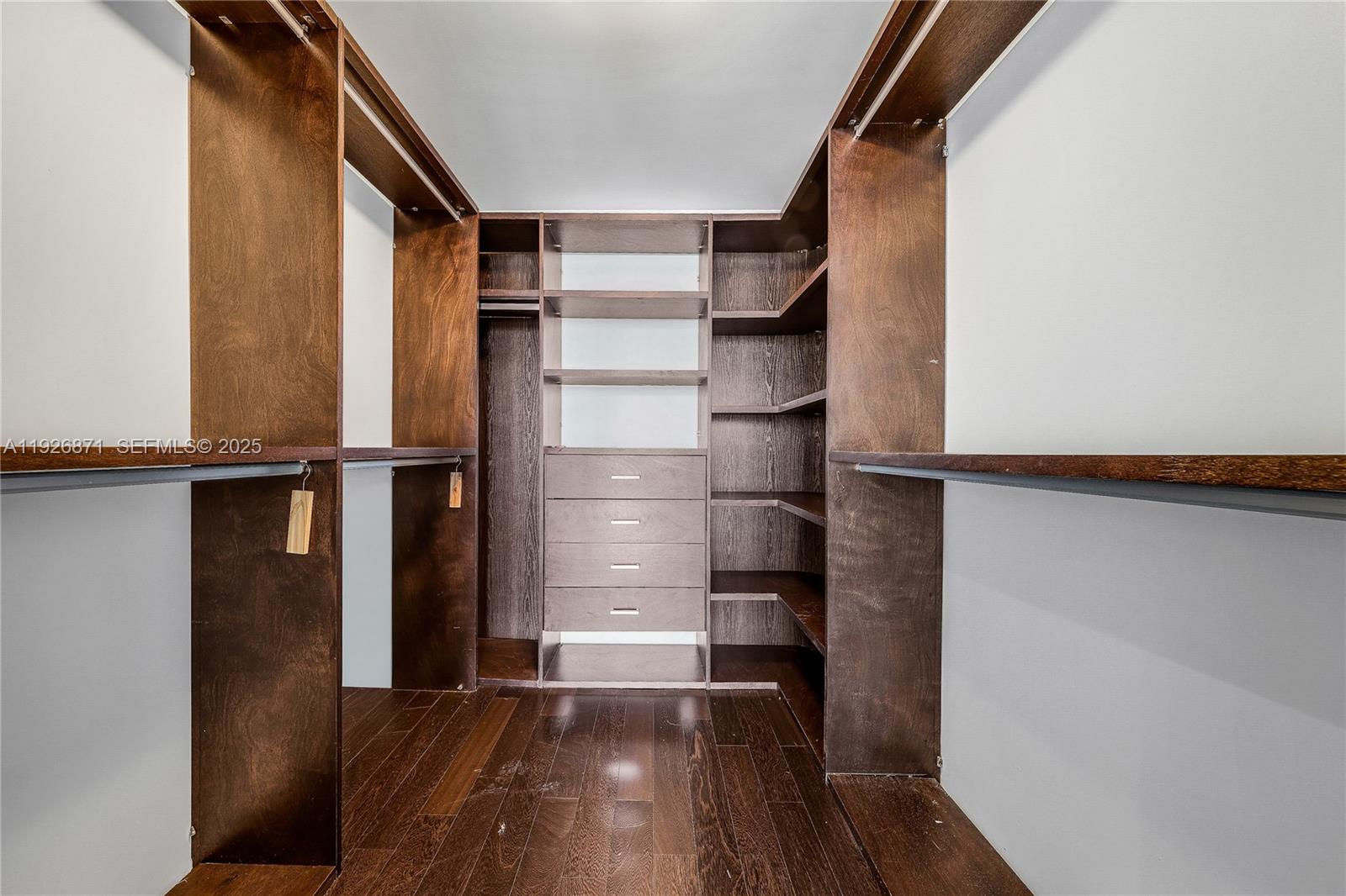 1100 Biscayne Boulevard, Unit 3103 Miami, FL 33132 - Photo 19 of 28 a view of walk in closet with empty racks