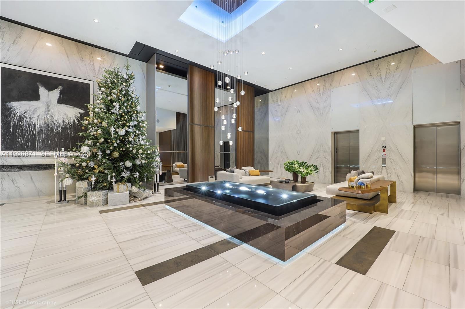 1100 Biscayne Boulevard, Unit 3103 Miami, FL 33132 - Photo 3 of 28 a living room with furniture and a potted plant