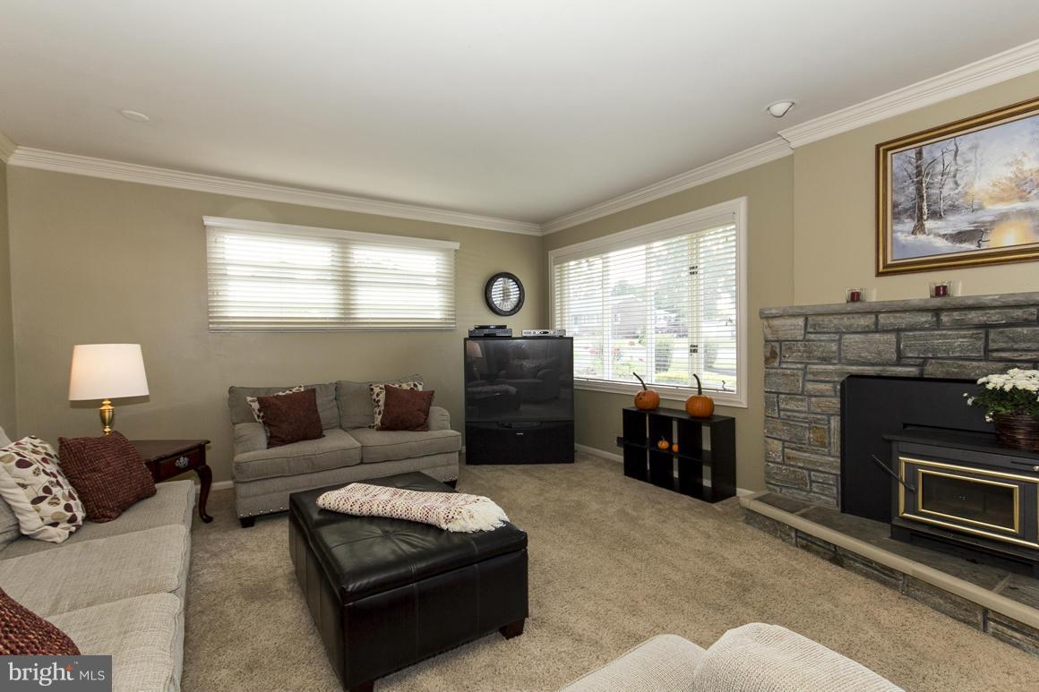 4012 Kahlston Road Baltimore, MD 21236 - Photo 13 of 30 a living room with furniture and a fireplace