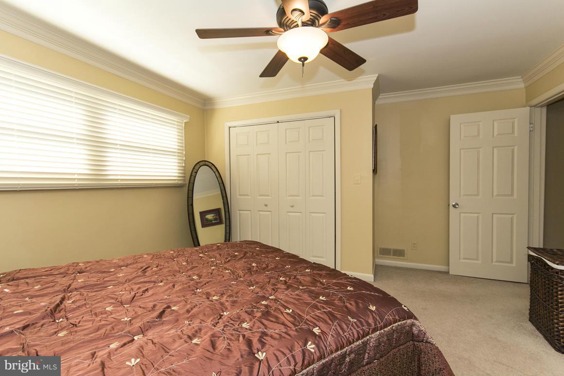 4012 Kahlston Road Baltimore, MD 21236 - Photo 17 of 30 a bedroom with a bed and a window