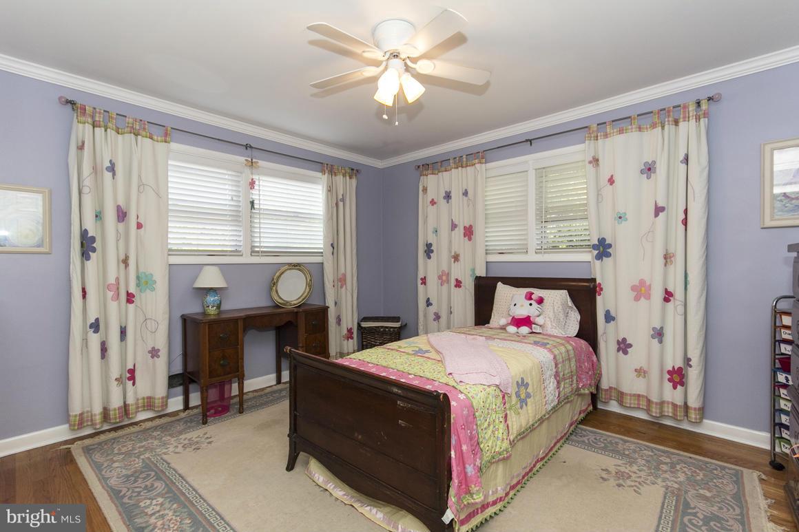 4012 Kahlston Road Baltimore, MD 21236 - Photo 20 of 30 a bedroom with a bed and a chandelier