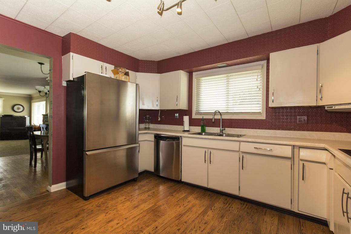 4012 Kahlston Road Baltimore, MD 21236 - Photo 6 of 30 a kitchen with stainless steel appliances granite countertop a refrigerator sink and cabinets