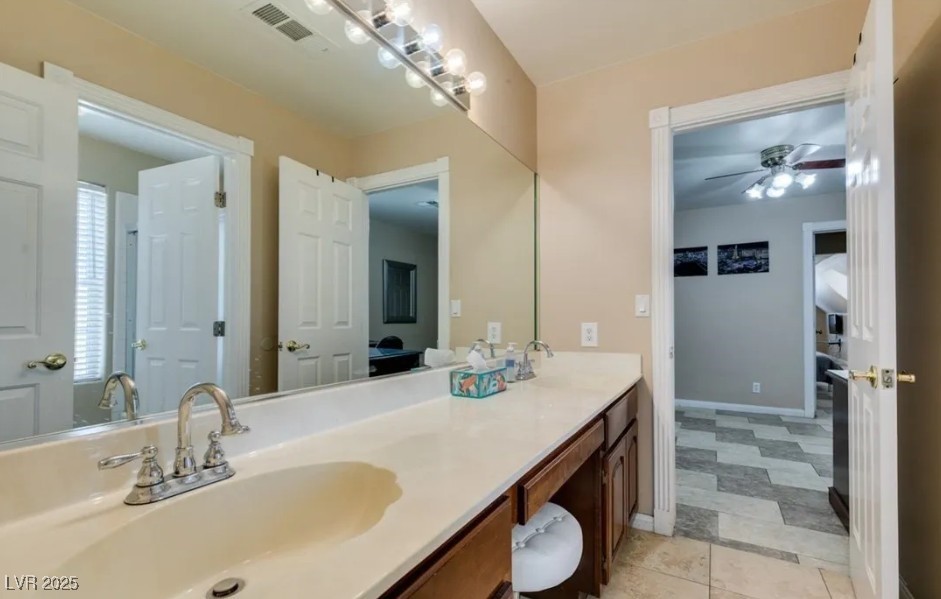 6520 Turtle Hill Road Las Vegas, NV 89110 - Photo 29 of 59 Bathroom with double vanity, a ceiling fan, and light tile patterned floors