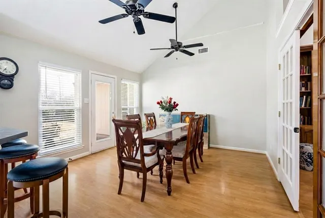 a view of a dining room with furniture and window