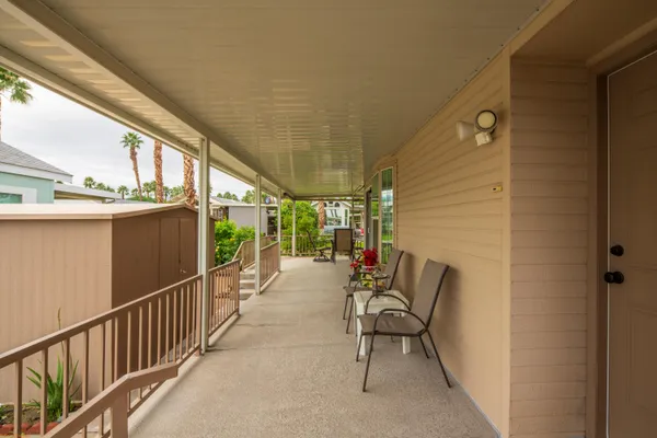 a bedroom with a large bed and a lamp