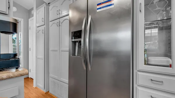 a view of a house with backyard and porch