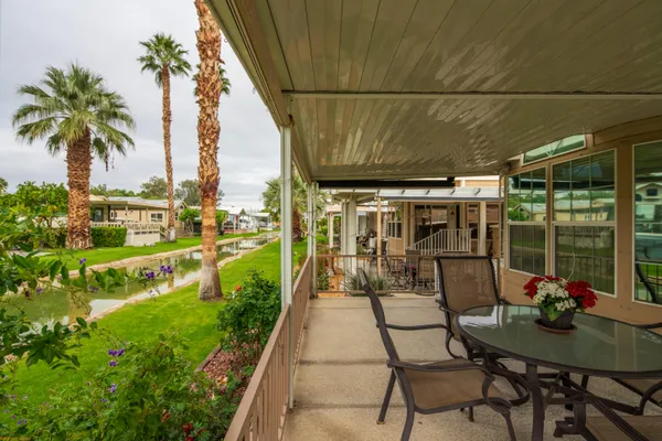 a view of swimming pool with outdoor seating