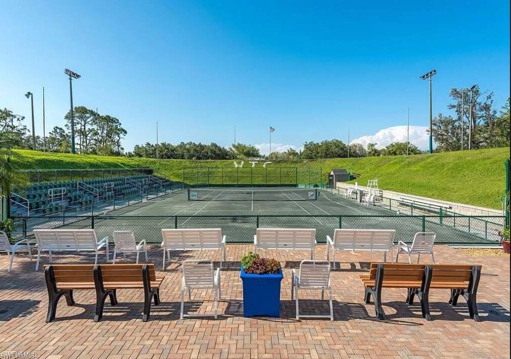 3324 Olympic Drive, Unit 324 Naples, FL 34105 - Photo 11 of 12 a view of a lake with couches and city view