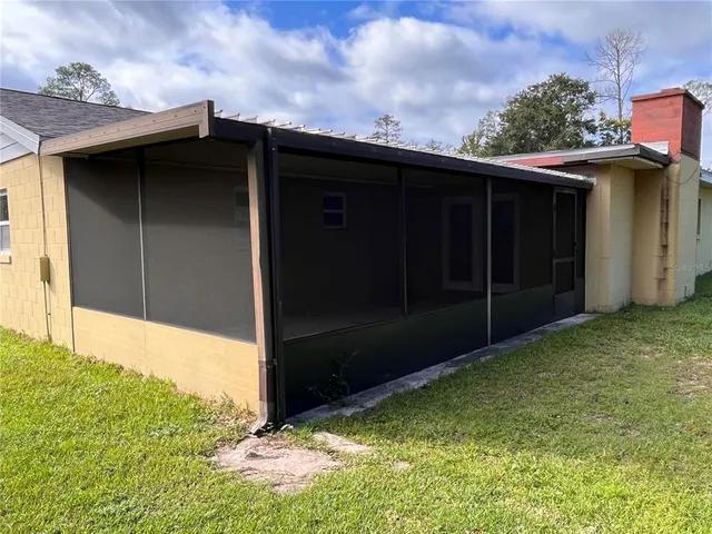 a kitchen with granite countertop a sink cabinets and stainless steel appliances