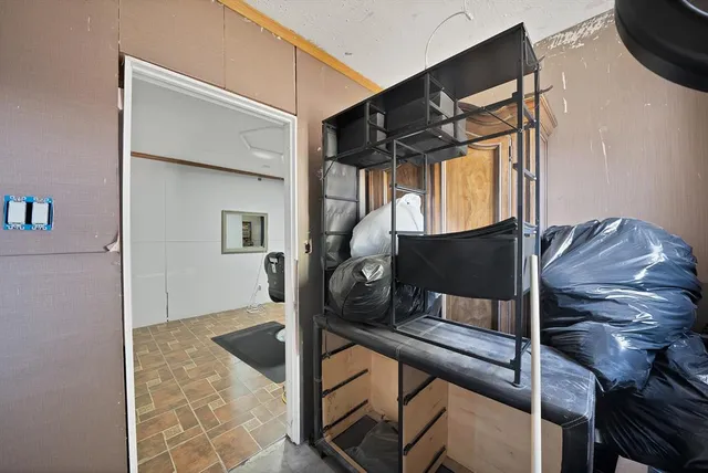 a work room with furniture and wooden floor