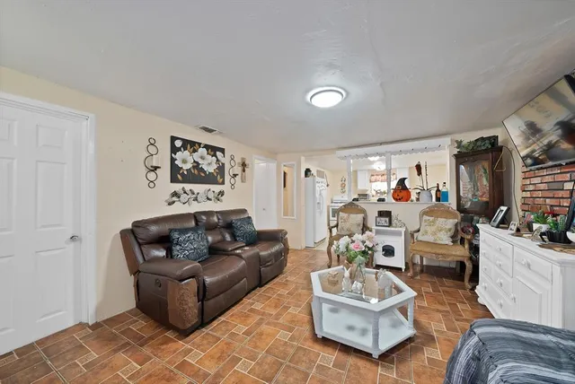 a living room with furniture and a couch