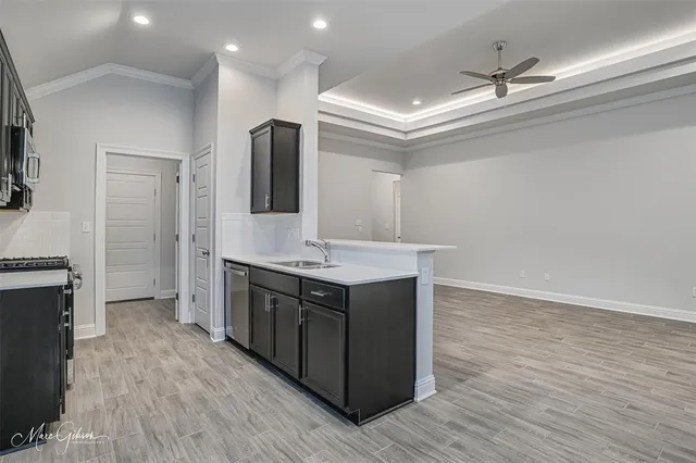 a bathroom with a sink a vanity and a large mirror